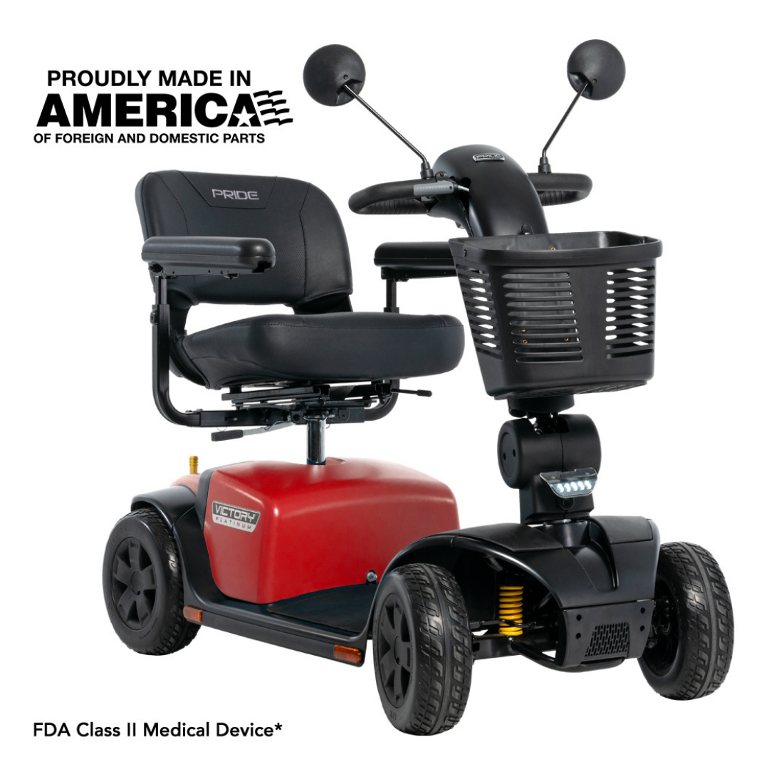 A red and black Pride Mobility Victory® Platinum Bariatric 4-Wheel Scooter with EZ Turn Technology features a front basket, padded seat, and two rearview mirrors. Text: Proudly Made in America of Foreign and Domestic Parts. FDA Class II Medical Device.*.